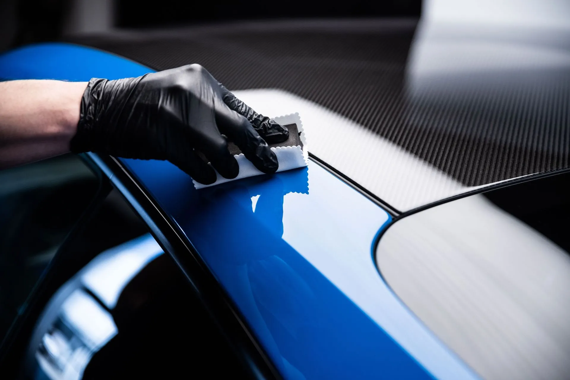 Application de revêtement céramique chez Moojo Auto Spa